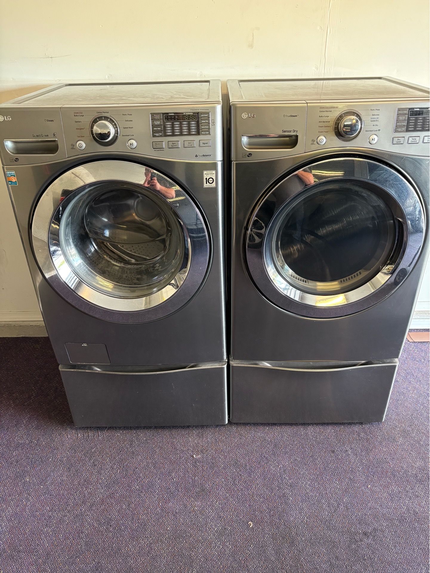 LG front load washer and matching electric dryer.