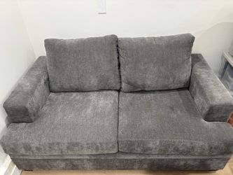 Living Spaces Grey Love Seat