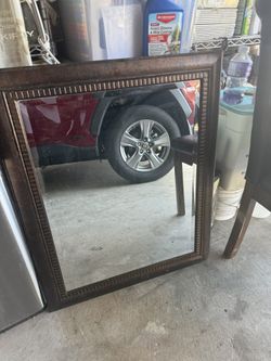 Beautiful bronze mirror in good condition asking 25