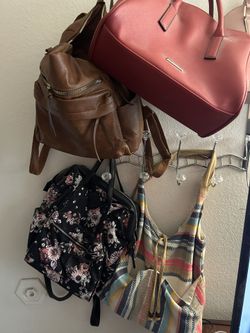 Multiple Woman’s Purses And Some Wallets