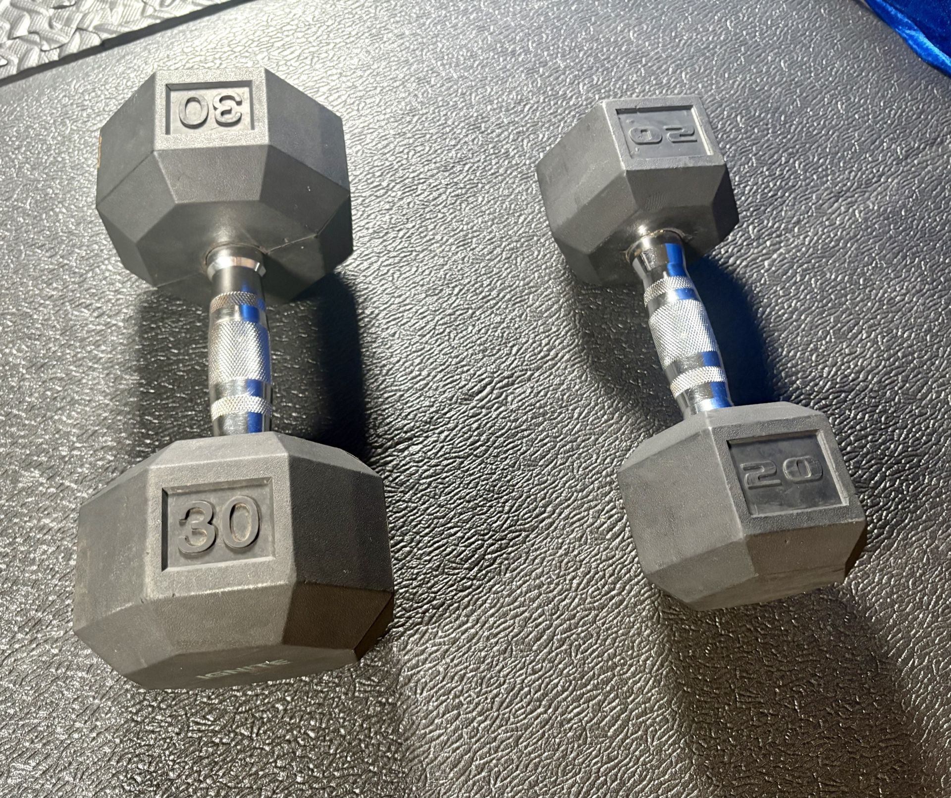 Set of Hex Cast Iron w/ Rubber Coat Dumbbells Singles 20# & 30# In total: 50 pounds.