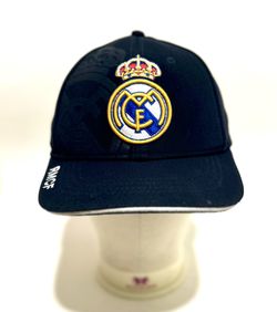 Real Madrid baseball cap, likely the "Crest Detail Cap" or a similar officially licensed product. The navy blue or black cap features the embroidered,