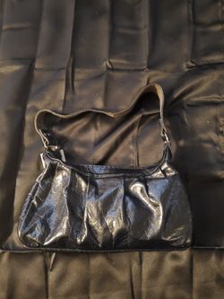 Is black leather woman's handbag