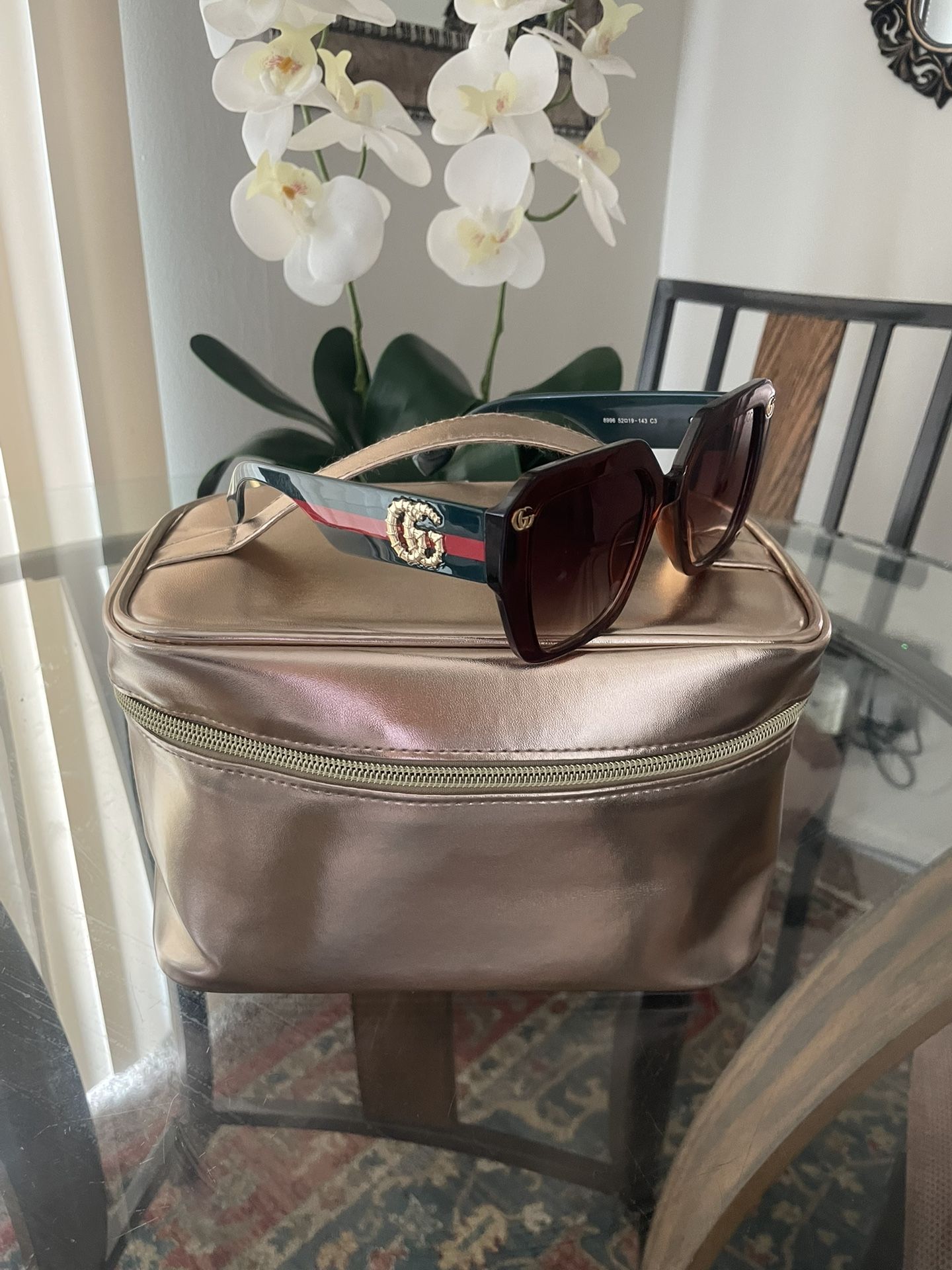 Sunglasses And Makeup Bag