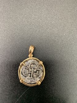 Atocha silver coin pendant in gold bezel