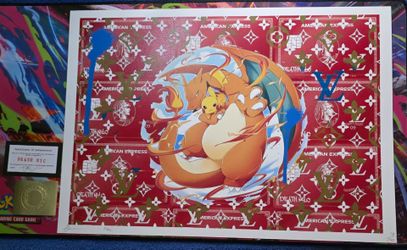 Original banks, he print featuring charzard holding pikachu. Charzard, ready to light the town up and in the background, louis vuitton.