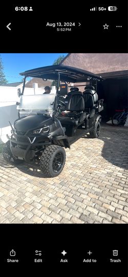 Six seater golf cart with cooler in the 6th seat