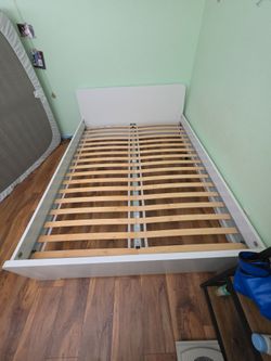 ASKVOLL IKEA queen bed frame with slats