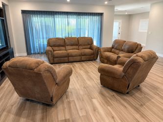 four piece brown upholstered living room reclining set