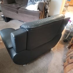 2 black leather chairs
