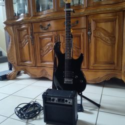 Peavy Rock master Guitar And  *New Capo (Was 15.99 On Amazon ) Peavy 9V battery Powered AMP