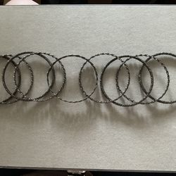 Set of Nine Black Metal Bangle Bracelets