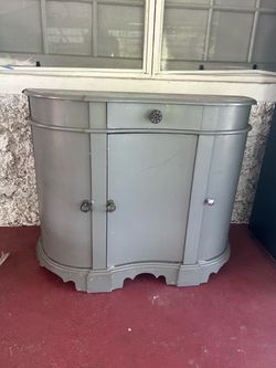 Sideboard in laquered & carved wood with three doors and a drawer
