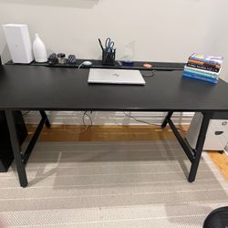 Great Looking Sleek Practical Desk in Excellent Condition 63”wW x 23”d x 28.5”h. It has an additional back shelf that is 8”d there is also a netting a