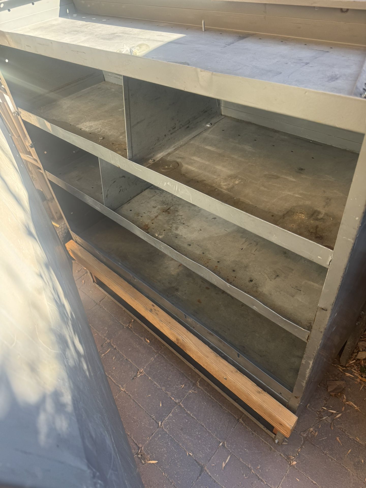 Steel shelf for a work van.