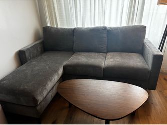 Living Spaces Gray couch with reversible chaise & coffee table