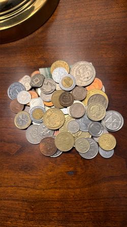 $25 Over 60 coins from around the world assorted dates and denominations