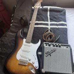 Fender electric guitar and Squire Amp