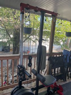 Home gym and lay pull down machine