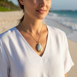 Natural Iridescent Abalone Donkey Ear Shell Framed Hammered Gold-tone Bezel Bail Pendant Excellent Condition.  PENDANT ONLY, NO NECKLACE INCLUDED. Thi