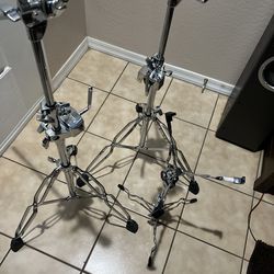 Two Roland cymbal stands and a snare stand