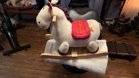 Baby riding unicorn