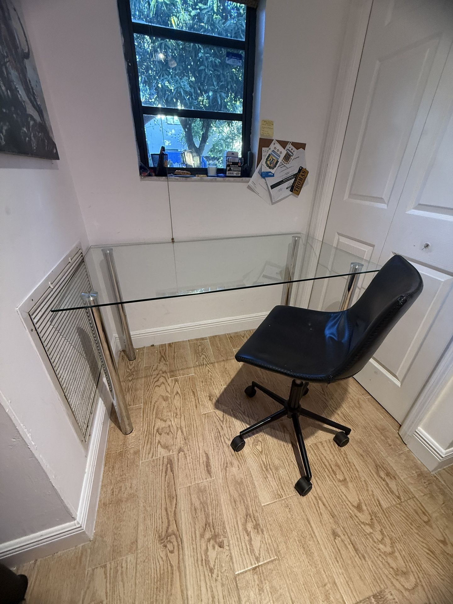 glass top desk with leather rolling chair