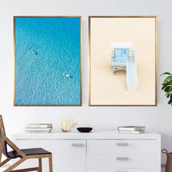 Beautiful 2 piece beachy prints “shallow waters & off duty” each 24” x 32 with floating black frame