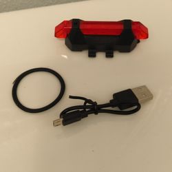 Rechargeable LED Bicycle Back light. Charge chord n strap