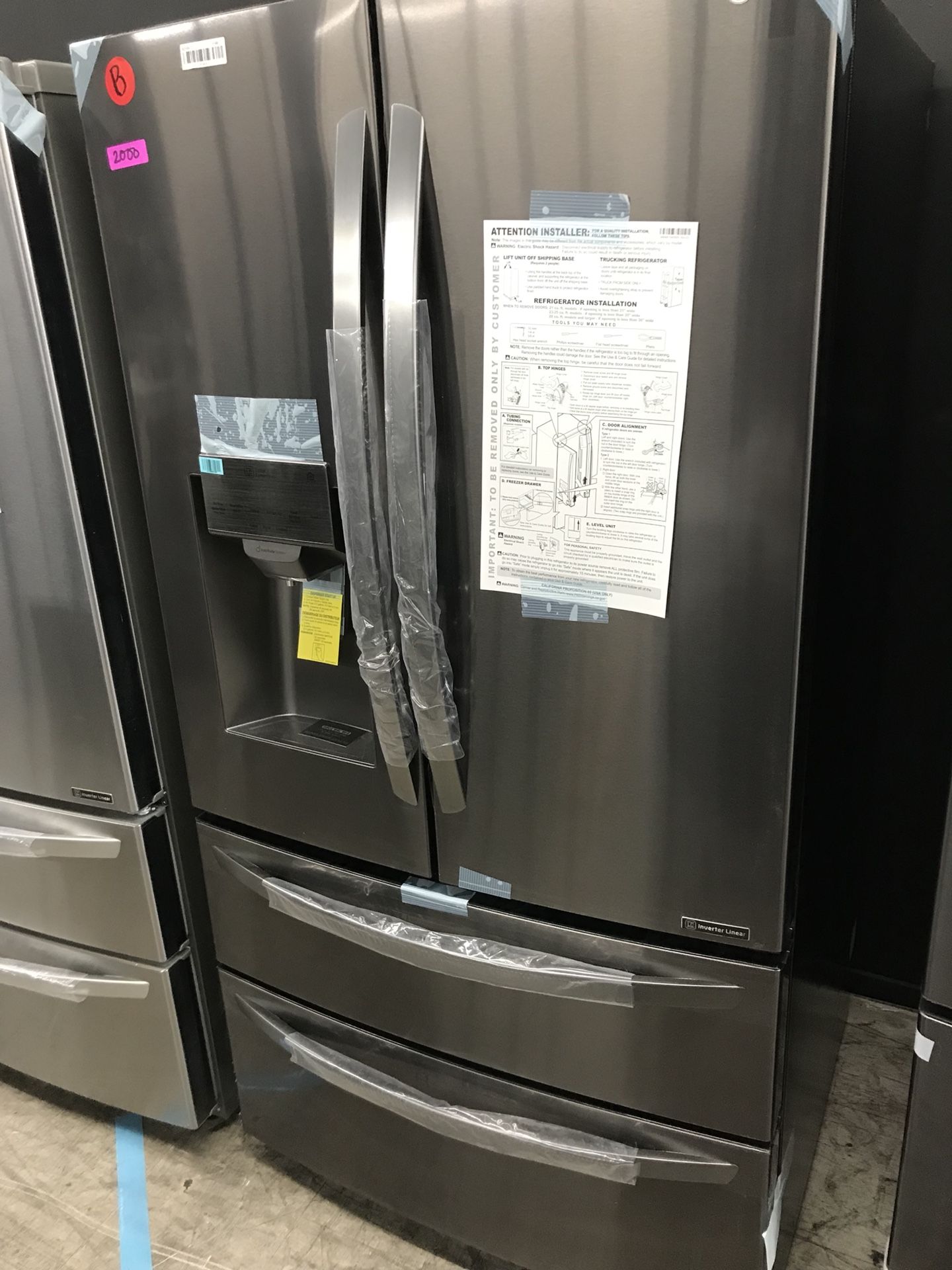 New LG 4 door refrigerator 28 cubic feet WiFi black stainless steel