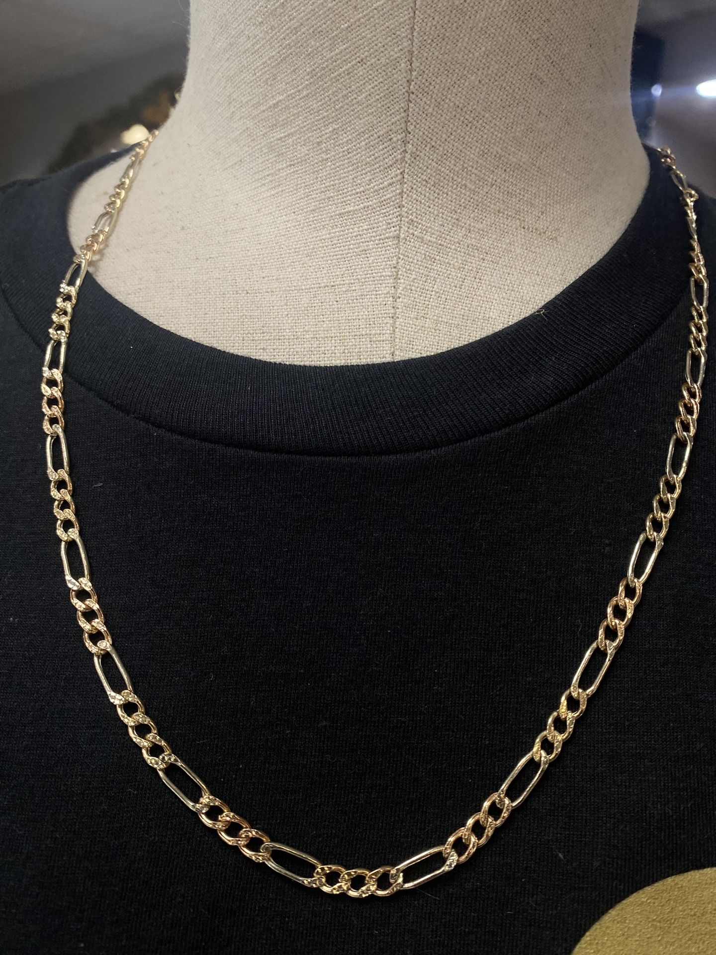 14 karat yellow gold Figaro chain 24”
