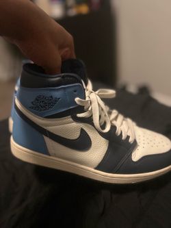 White and navy blue Jordan ones