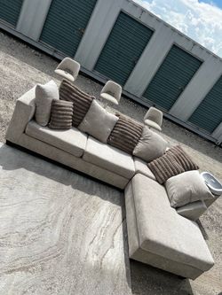 Living room sectional with rug and stool