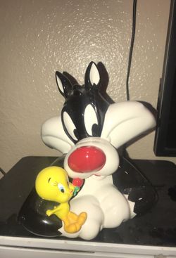Sylvester and tweetie piggy bank/ coin bank