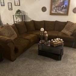 Ashley Stewart Section Sofa Table And Two Chairs And A Sleeper Bed