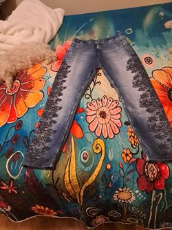 Flower pattern on outside of each pant leg.