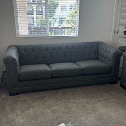 2 Grey Chesterfield-Style Couches – Excellent Condition!