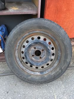 Toyota Camry 14” steel rim, tire holds air, ONE RIM