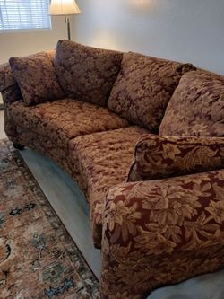 Burgundy and gold sofa
