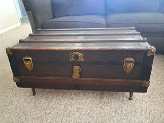 Antique steamer trunk coffee table. Interior is unfinished. 38.5"W x 22"D x 18.5"H (without legs 13.5"H)