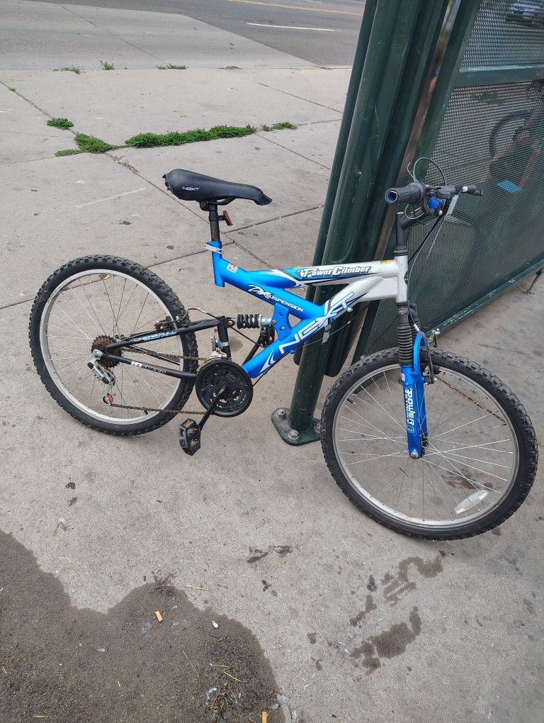 NEXT ZX suspension; 18 speed (grip shifter); bike seat can be adjusted for heights 5’0 ft to 5’10” (not recommended for people taller).
Brake line nee