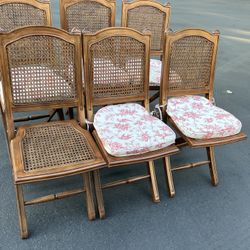 6 Ballard Design Woven/Rattan Folding Chairs W/Removable Cushions(See & Click On Pictures). Still In Good Condition And Useable(Missing 1 Pillow)