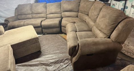 Brown recliner couch has four recliners, great condition, clean. We sell all the time. delivery $40 local