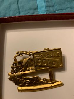 Real Estate brooch.