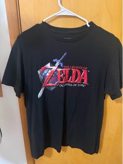This is a black Nintendo Legend of Zelda Ocarina of Time graphic t-shirt large on tag  Very good condition  Smoke free home