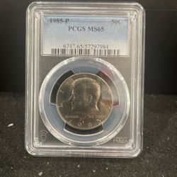 1985 P Gem Uncirculated Kennedy Half Dollar Graded At MS65 By PGCS 4-5
