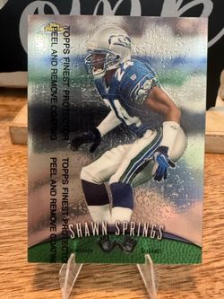 1997 Topps Finest football card featuring Shawn Springs of the Seattle Seahawks, with the protective plastic coating