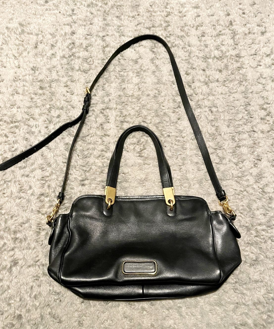 Marc by Marc Jacobs shoulder bag with crossbody strap. Retail $498. Black bag with gold medal details. Adjustable strap. Great condition!