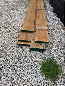 11 wooden posts, 8 feet long