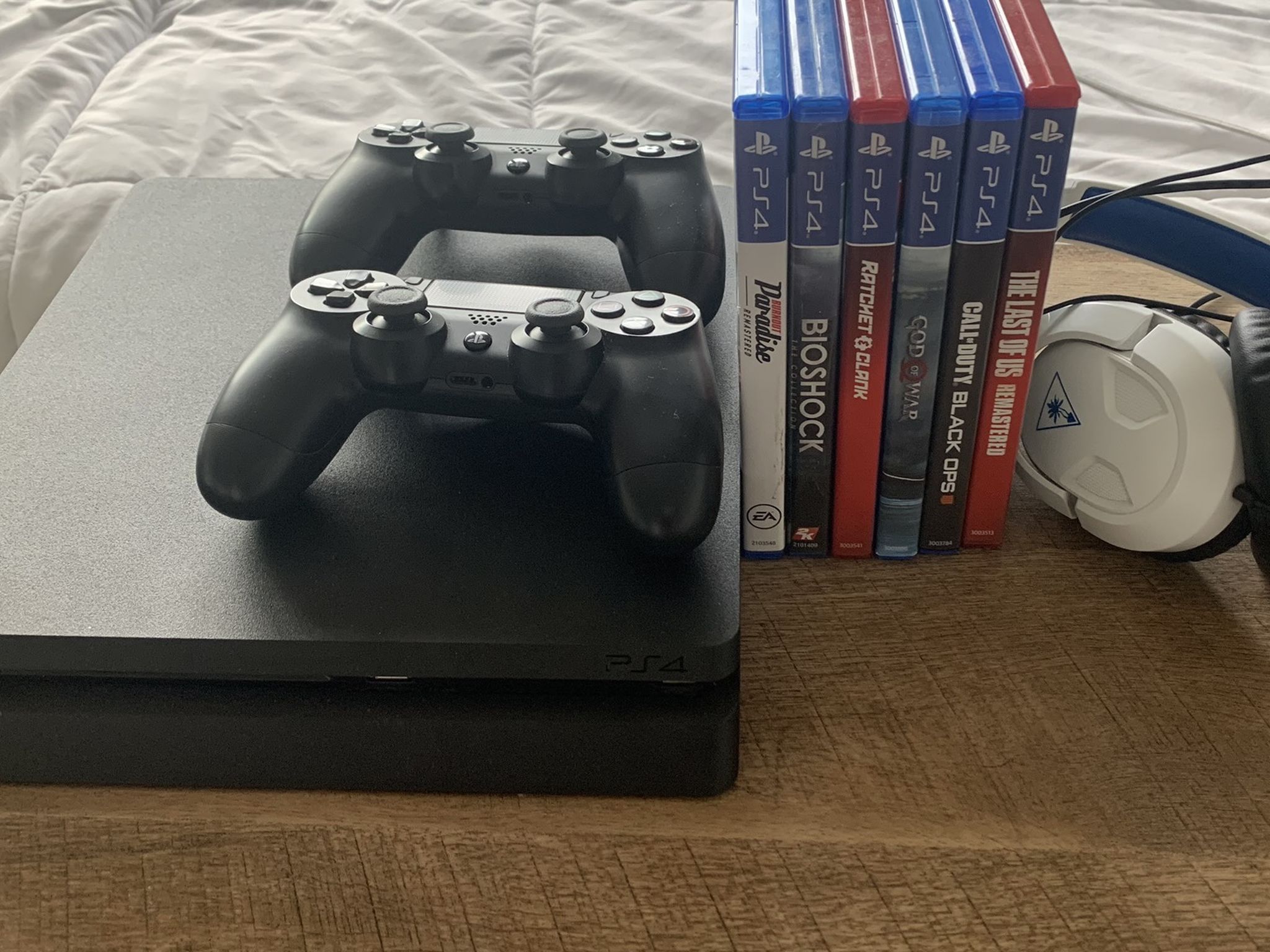 PS4 Slim 1tb w/ Two controllers, turtle beach headset and games in picture.